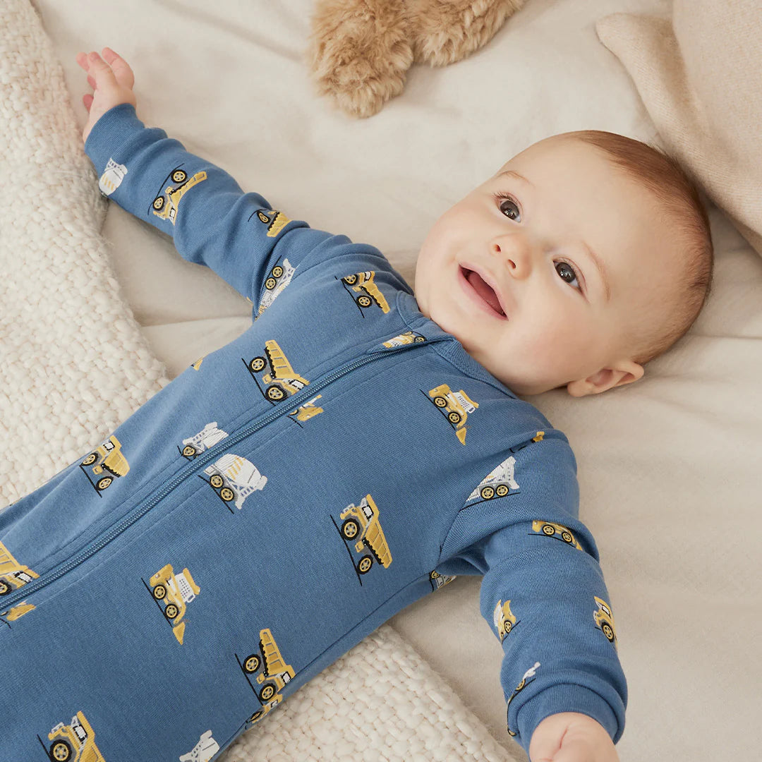 Footed Sleeper | Construction Truck Print on Cobalt Blue | Petit Lem