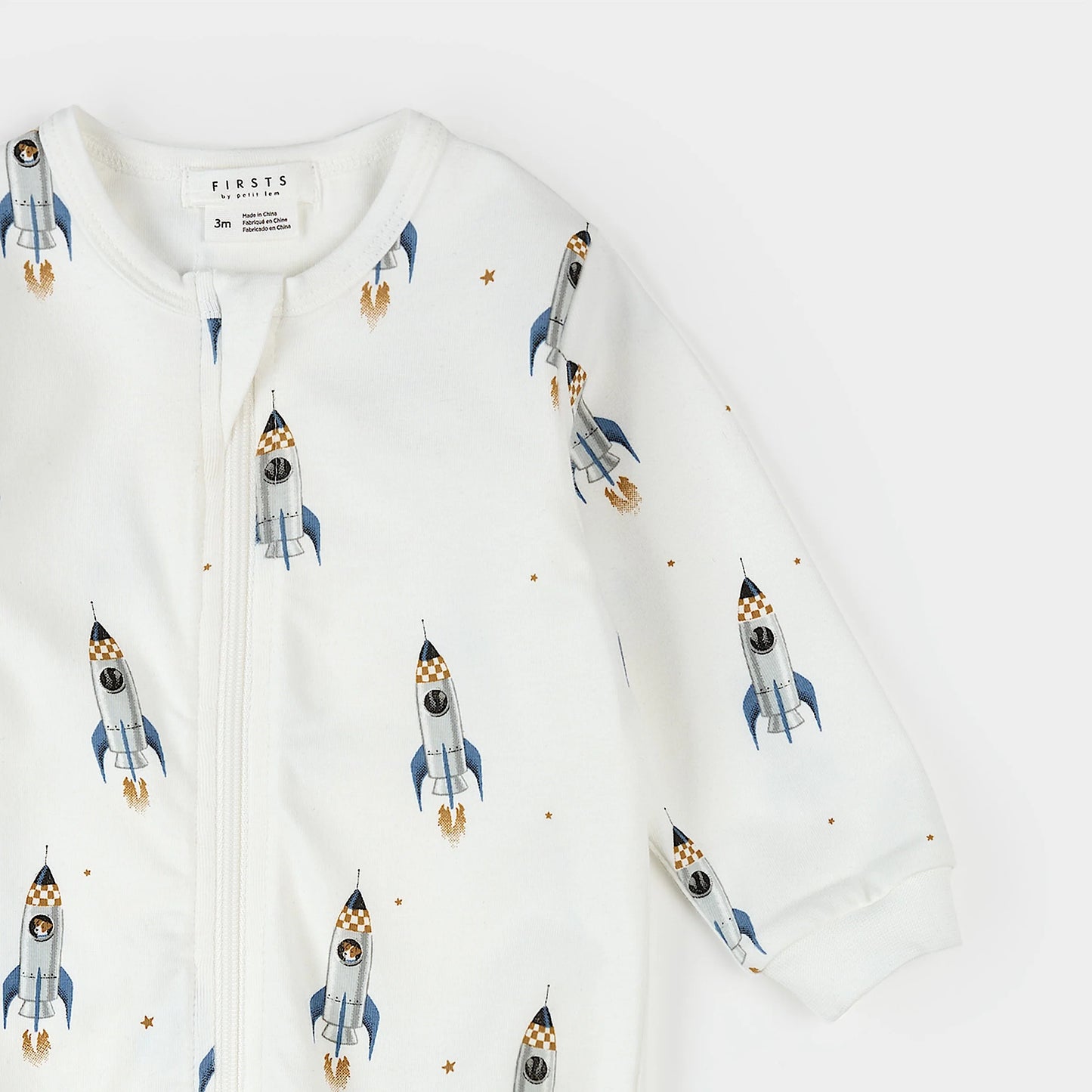 Rocket Print on Off White Footed Sleeper | Petit Lem