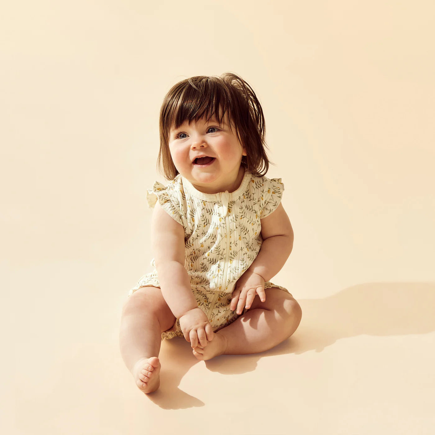 Lemon Leaf Organic Ruffle Zipsuit | Wilson + Frenchy